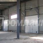 Промышленные секционные подъемные ворота Doorhan с калиткой высокий подъем